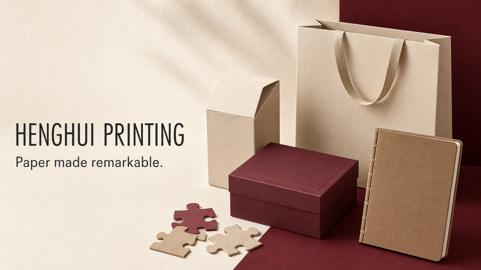 A presentation of custom paper packaging, a paper bag, gift box, puzzle pieces and notebook